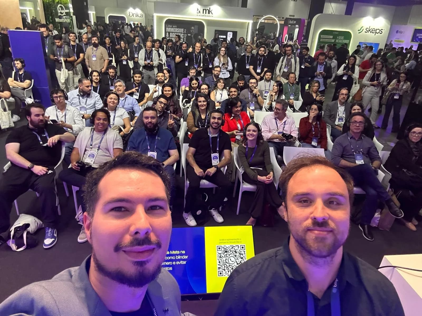 Datatchê's CEO taking a selfie with the audience during a talk on real-time DLP at Blip's event