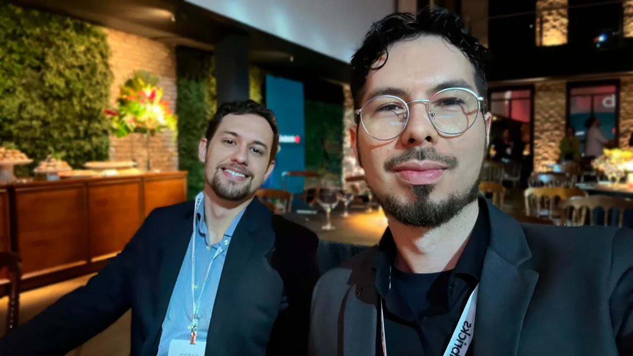 Selfie of two team members at an event dinner